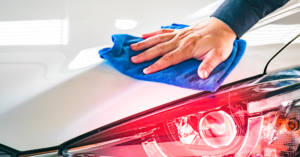 a man is detailing his personal vehicle