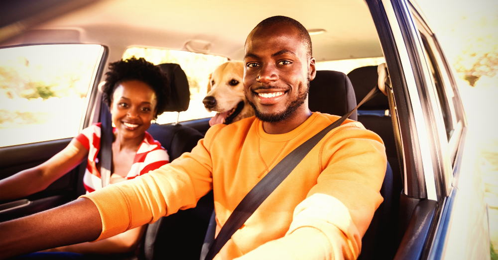 A man, woman and dog enjoy a smooth trip because they rented a car from Midwest Car Share through the Turo app